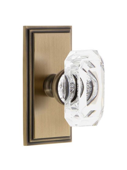 Grandeur Carre Rosette Door Set with Clear Crystal-Glass Baguette Knobs in Antique Brass.